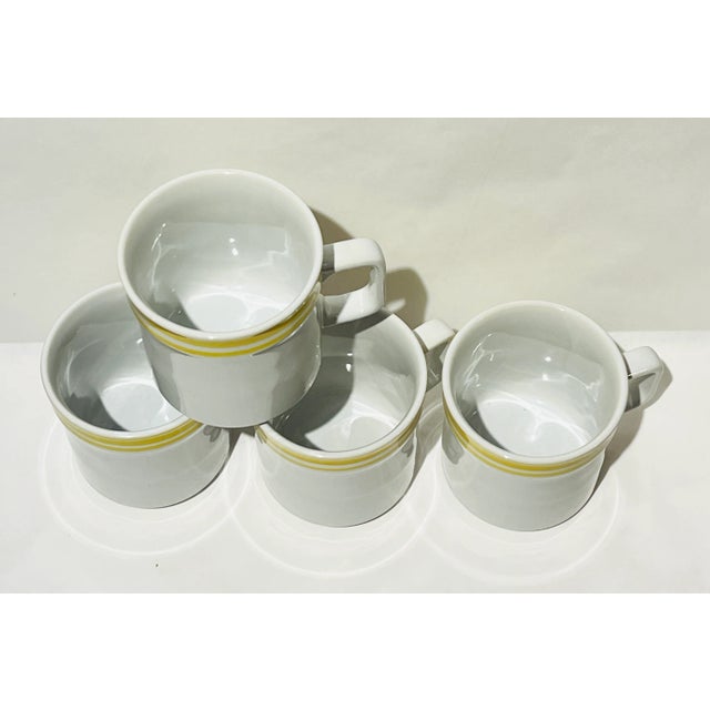 Love this set of four vintage yellow mugs! Adorable and bright for your breakfast table!