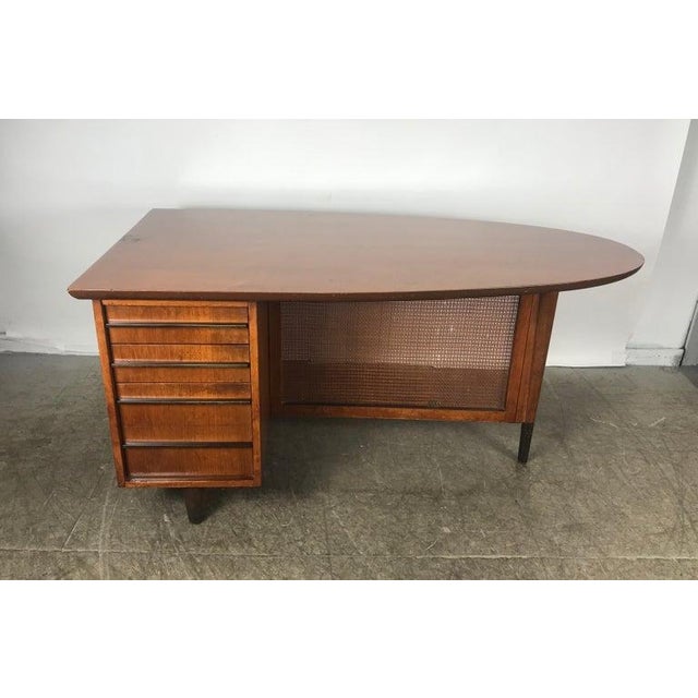 Unique mid-century modern half oval shaped walnut partners desk by Miller Desk & Safe Co. with removable caned modesty...