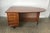 Unique mid-century modern half oval shaped walnut partners desk by Miller Desk & Safe Co. with removable caned modesty...
