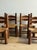 A charming set of four low rush-seat chairs by French designer Charles Dudouyt (unmarked), known for his rustic modernist...