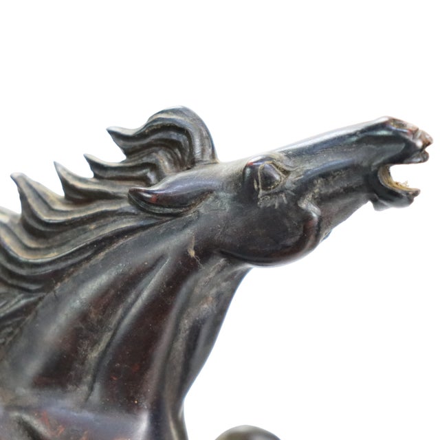 A carved black jasper Feng Shui 8 Running Horses horse-group sculpture, dated circa 1920. Eight horses are shown galloping...