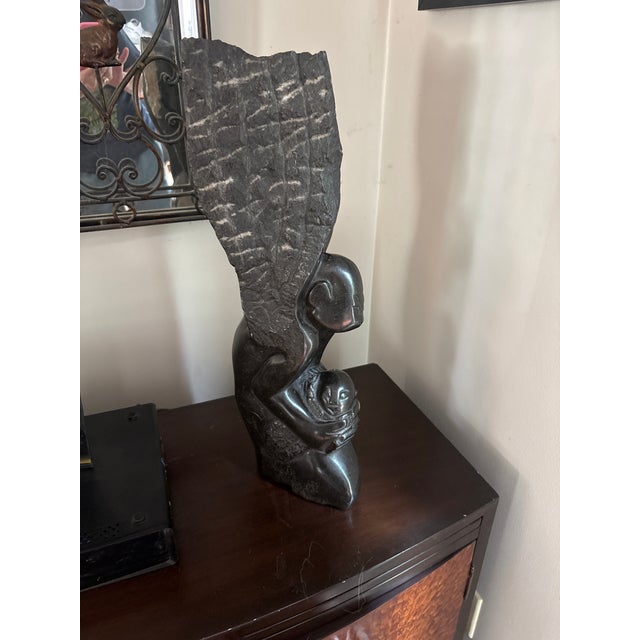 Jonathan Mhondorohuma Sculture hand-carved Shona sculpture from Zimbabwe made of springstone, featuring contrasting...