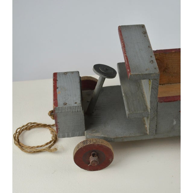 Charming French handmade wooden toy car, most likely dating from the late 1930s or the 1940s. Entirely handcrafted in...