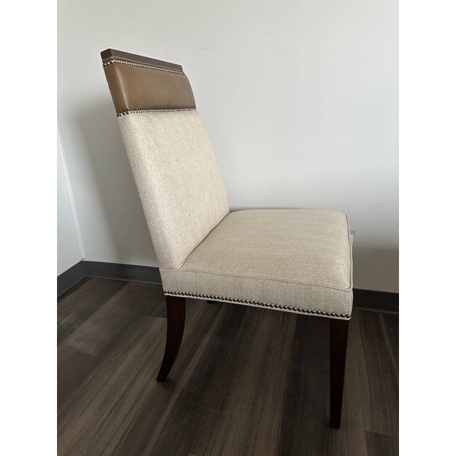 The Phelps Dining Chair by Vanguard combines refined comfort with timeless craftsmanship. Thoughtfully designed with clean...