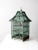 This antique painted wooden birdcage features a charming peaked roof and a gently timeworn finish that enhances its...
