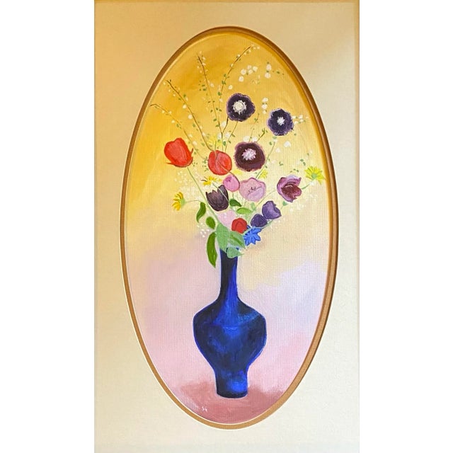 Oil painting of a still life floral with blue vase, framed in an oval mat and glazed by Satori Gregorakis. Monogrammed in...