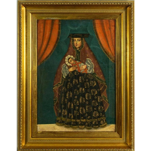 A richly decorative 19th-century Cuzco School, or Escuela Cusqueña, oil painting depicting the Madonna with the Infant...