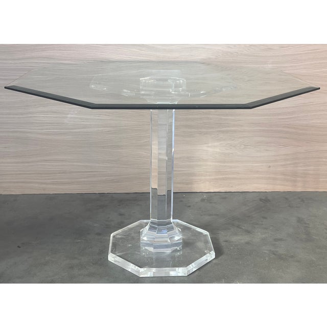 Lucite pedestal base dining table with octagonal glass top. Dimensions: Height: 29.34 in (74.5 cm)Width: 46.46 in (118...