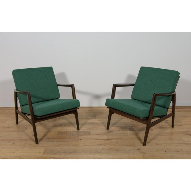 This pair of armchairs was produced by the Polish company Swarzędzka Furniture Factory in 60s.The armchairs have new...