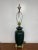 Vintage Mid-Century Hollywood Regency style green ceramic table lamp with elegant brass-tone base and accents. A timeless...