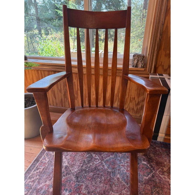 A pair of genuine Cushman Colonial Creation armchairs, model 9082, known as the "Salem" design, made by the H.T. Cushman...