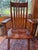 A pair of genuine Cushman Colonial Creation armchairs, model 9082, known as the "Salem" design, made by the H.T. Cushman...
