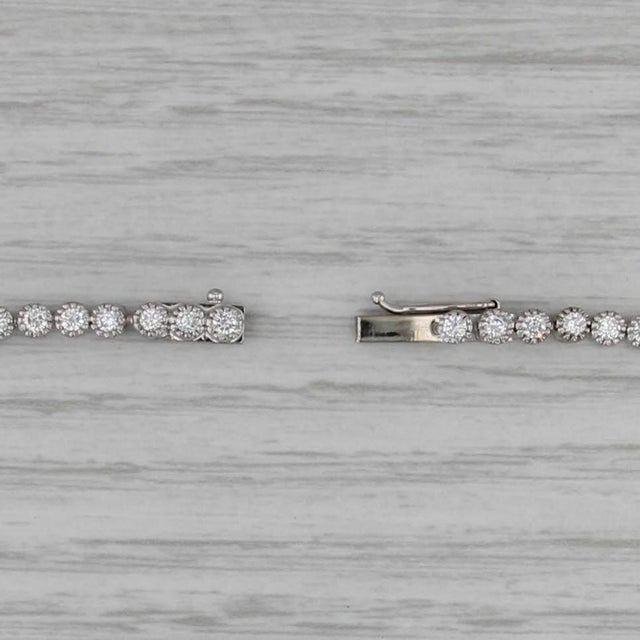 Gemstone Information: - Natural Diamonds - Total Carats - 1.50ctw Cut - Round Brilliant Color - F - H Clarity - VS2 - SI2...