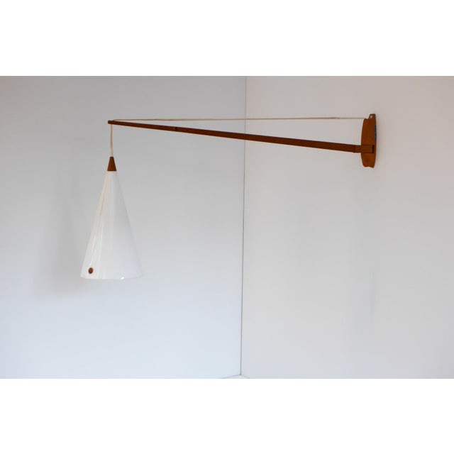 Rare midcentury Swedish swiveling wall lamp, Model 734, designed by Uno and Östen Kristiansson for Luxus, Sweden, 1960s....