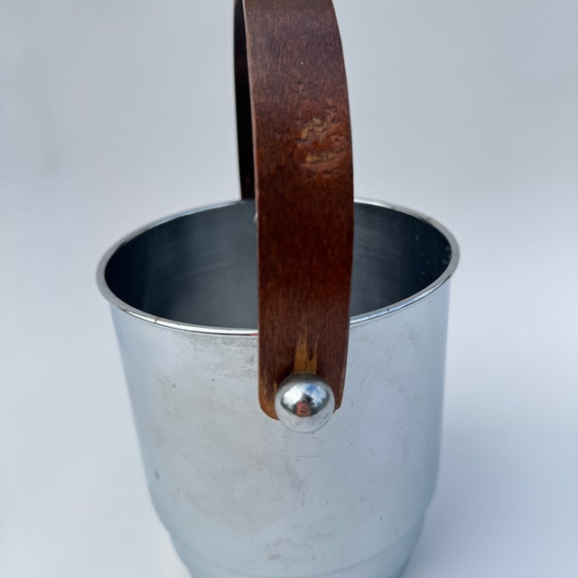 Circa 1940s Manning Bowman chrome ice bucket with bentwood handle. Made in the USA from quality materials. In good...