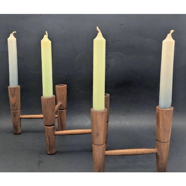 Offered is a vintage mid 20th Century Scandinavian Modern carved and lathed articulated Teak wood candelabra that holds 6...