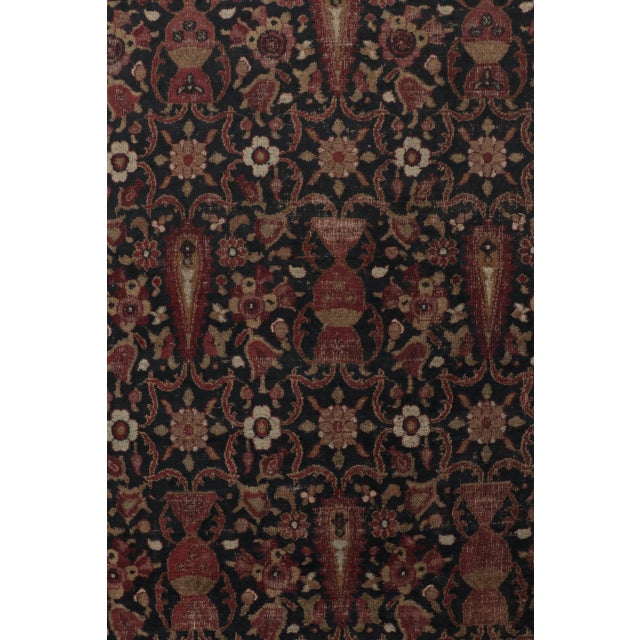 Hand-knotted in wool, this antique 9x13 Doroksh rug dates to circa 1800. The design features an intricate all-over pattern...