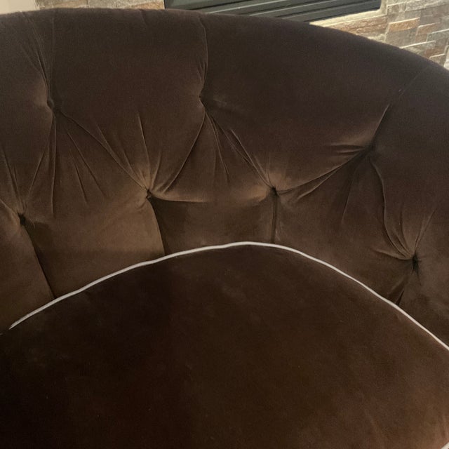 A pair of gorgeous brown velvet love seats reupholstered in brown velvet with the cushion trimmed in a light blue. Down...