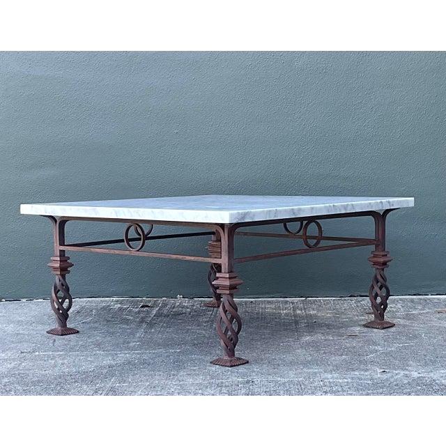 This vintage coffee table is a masterful marriage of industrial strength and classical Mediterranean elegance. The heavy...