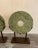 A pair of large round hardstone or marble Chinese sculptures with custom aged steel bases. the stone circles are 24...