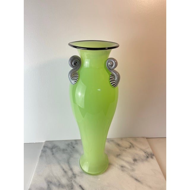 Contemporary art glass vase by Seattle Artist, Dehanna Jones, featuring a soft pale lime green hue and elegant modern form...