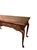 Elegant vintage Queen Anne–style console table featuring richly figured burl wood veneer in a warm medium-brown finish....