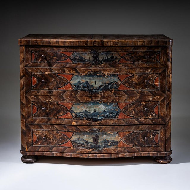 Large four-drawer Baroque commode featuring its original painted decoration, imitating wood grain and embellished with...