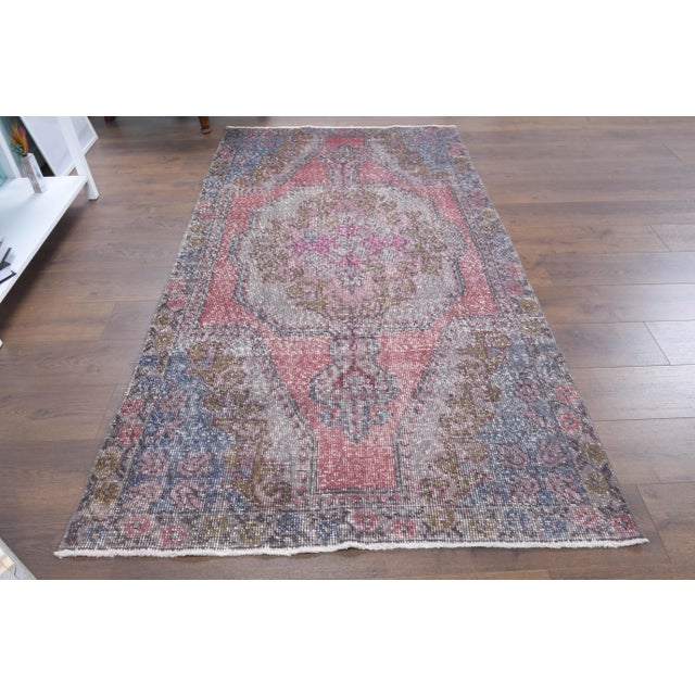 Vintage Turkish Hand-Knotted vintage rug is a semi-antique vintage area rug.'70s Eastern region of Turkey's unique rug is...