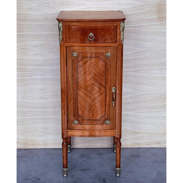 A charming and elegant pair of period Louis XVI (1774-1792) French chiffoniers. circa 1930 Exquisitely hand-crafted in...