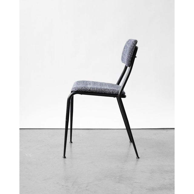 This vintage chair from the 1960s has been reupholstered in a high-quality Italian fabric. It features a sturdy metal...