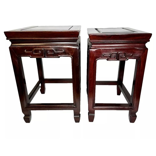 Pair of Mahogany Ming Dynasty Style Asian Wood End Tables with nice scroll detail and pagoda like top. Approximate...