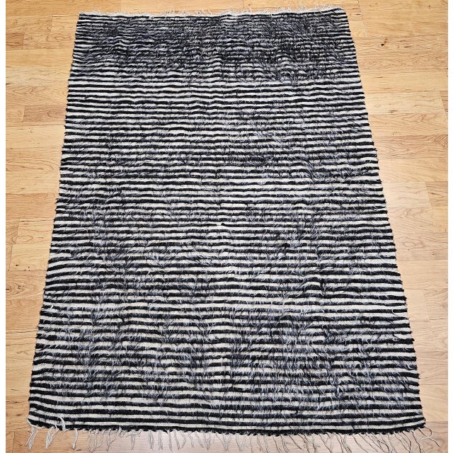 A beautiful vintage Turkish Tulu area rug, handwoven in the second quarter of the 20th century in the distinctive...