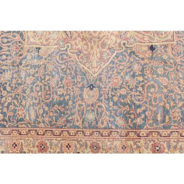 SE Persian city, famous since 17th century for an artistic variety of scatter rugs and large carpets in medallion and...