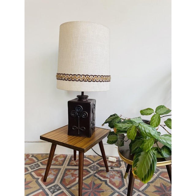 West Germany table lamp in ceramic with a fabric shade featuring a lovely embroidered pattern. Dimensions: H 59 cm Shade...