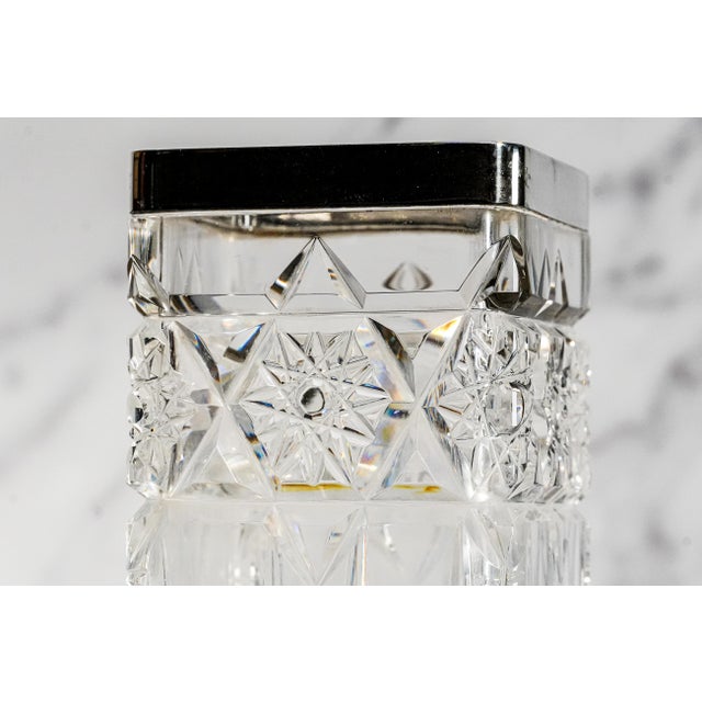 This elegant vintage crystal vase with sterling silver rim is a beautifully substantial decorative piece, combining...