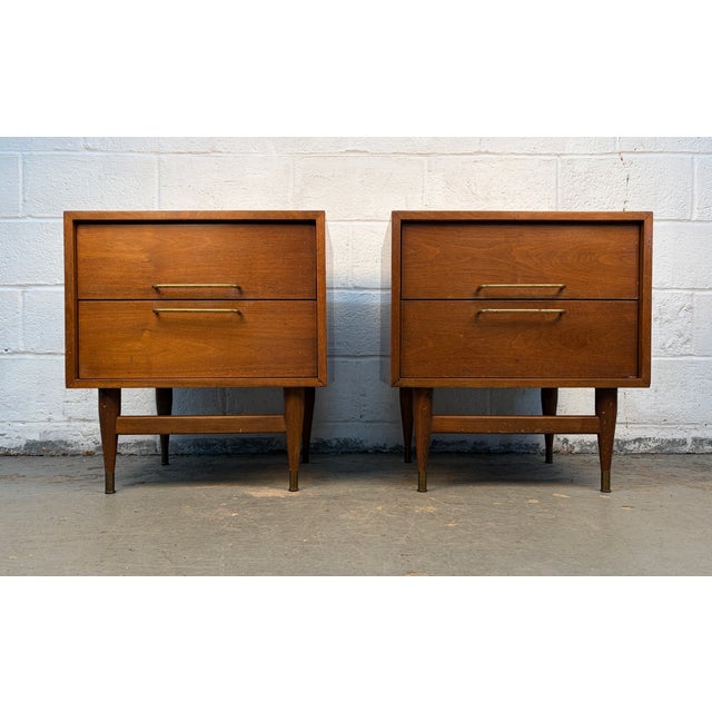 Bring timeless sophistication to your bedroom with this elegant pair of mid-century modern nightstands. Crafted in richly...