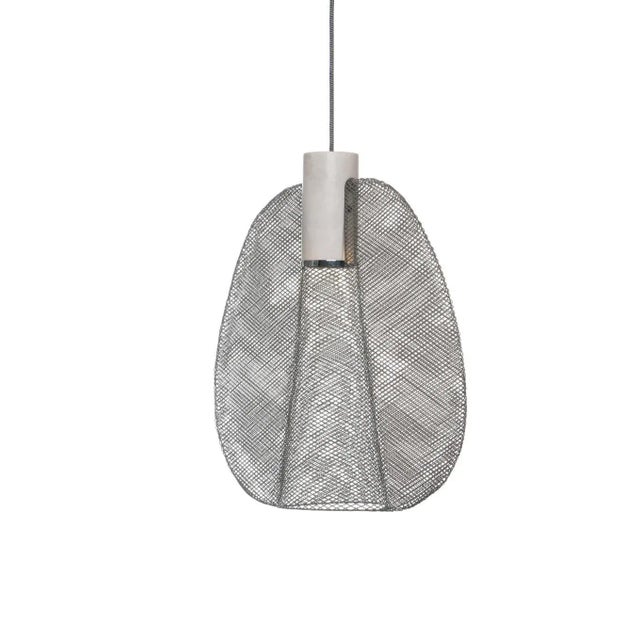 Handcrafted in the Philippines from galvanized iron wire, the Petiole Pendant by Schema for Oggetti features a woven...