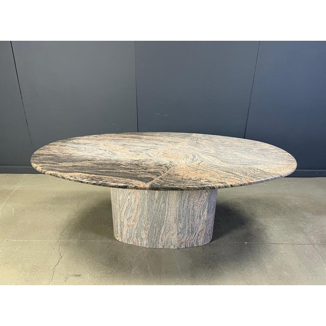 Large granite oval dining table with beautiful natural stone pattern and a central leg. Very good condition, timeless...