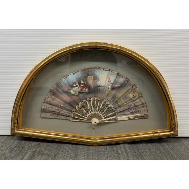 Design Plus Gallery presents an Antique Ladies Hand-Painted Fan in Decorative Display Frame. The delicate silk has been...
