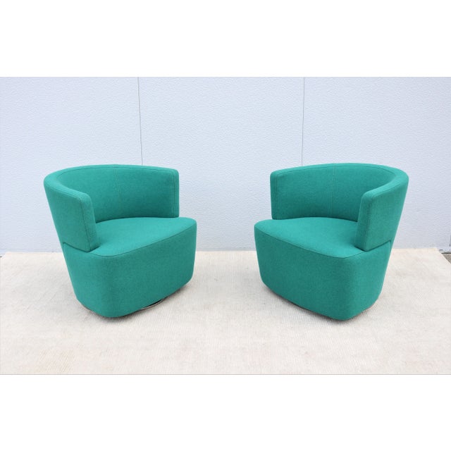 Fabulous pair of Joel teal blue swivel lounge chairs by Walter Knoll. The modern beauty and smart design of the Joel...