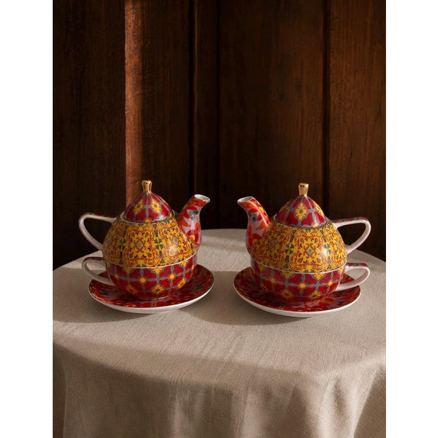 A cheerful and beautifully designed pair of T2 Tea-for-One porcelain tea sets featuring an exuberant Moroccan-inspired...