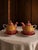 A cheerful and beautifully designed pair of T2 Tea-for-One porcelain tea sets featuring an exuberant Moroccan-inspired...
