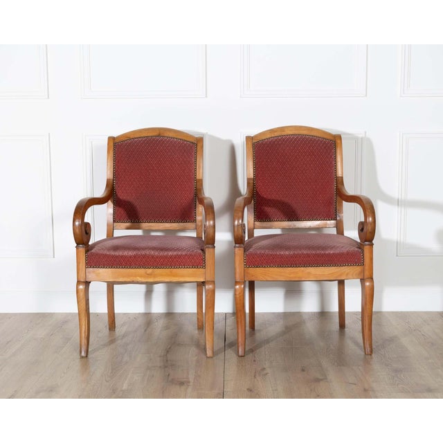 This elegant pair of Louis Philippe armchairs embodies the refined simplicity and balanced proportions of mid-19th century...