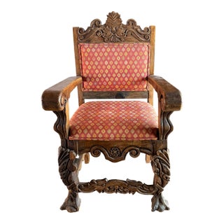 Late 19th Century A Spanish Colonial Revival Carved Hardwood Armchair. For Sale