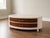 Beautiful custom refinished oval coffee table featuring a sculpted clay finish paired with rich walnut-stained drawers and...