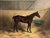 Here is a classic antique British sporting painting of a bay hunter horse in a loose box stall by Henry Frederick Lucas...