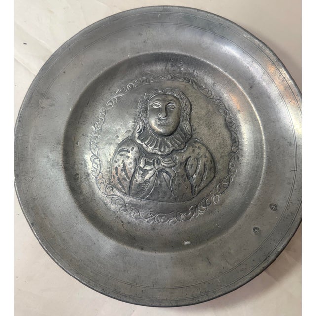 This antique 18th century tooled relief plate is a true masterpiece. Crafted with exquisite attention to detail, this...