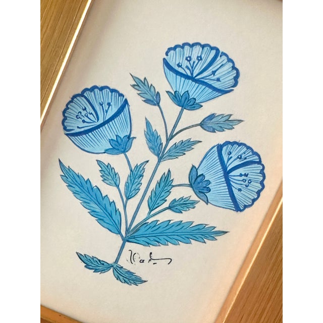 A beautifully hand-painted blue floral motif painting, created with exquisite attention to detail by our master artists....