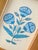 A beautifully hand-painted blue floral motif painting, created with exquisite attention to detail by our master artists....