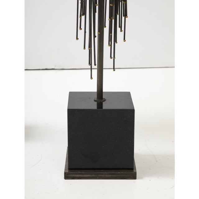 Large pair of 1970's Brutalist lamps. The Metal lamp forms sit on Black marble bases, that have been Newly rewired with...